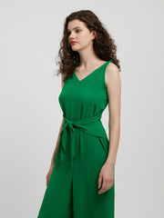 Emerald tie-waist wide leg jumpsuit in mid green with V-neck and sleeveless design.