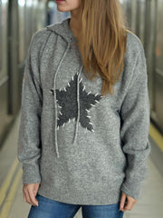 Gray knit hoodie with a textured dark gray star appliqué stitched with white thread.