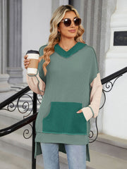 Waffle knit colorblock hooded tunic with contrast pocket and sleeves.
