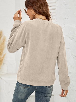 Sand corduroy sweatshirt with crew neck and long sleeves.