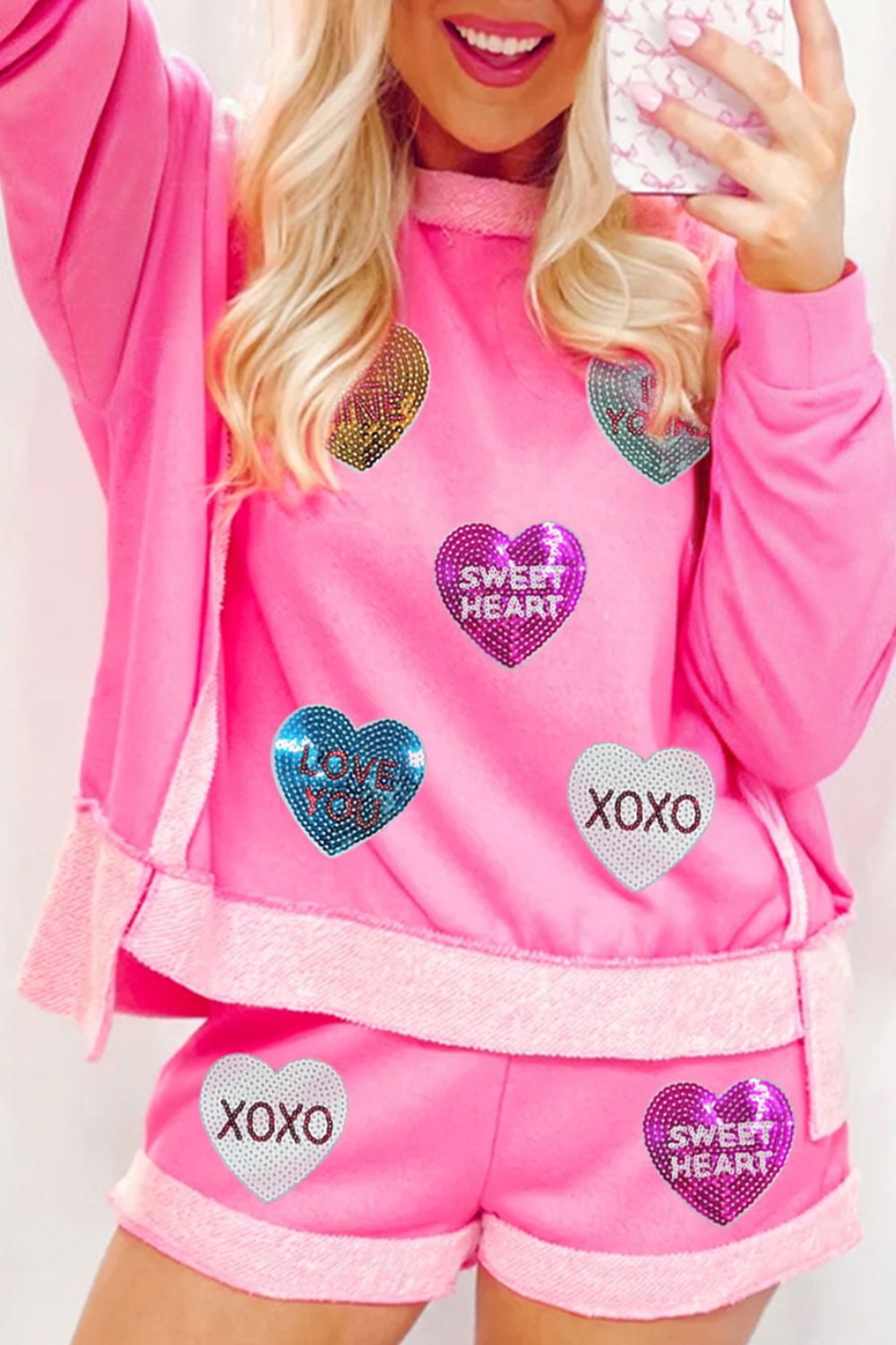 Pink loungewear set with heart sequin details and "Sweet Heart" and "XOXO" text.
