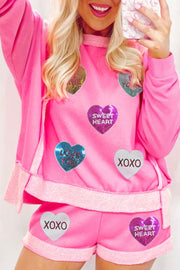 Pink loungewear set with heart sequin details and "Sweet Heart" and "XOXO" text.