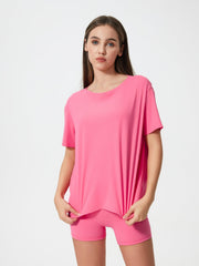 Relaxed fit performance tee in Fuchsia Pink with crew neck and short sleeves.