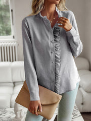 Striped ruffle-trimmed blouse with button front and stand collar.