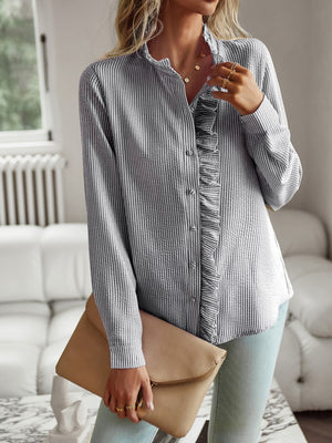 Striped ruffle-trimmed blouse with button front and stand collar.