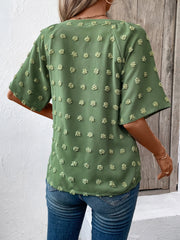 Moss green Swiss dot blouse with short sleeves and a V-neckline.