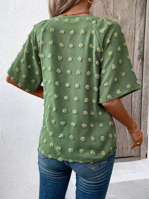 Moss green Swiss dot blouse with short sleeves and a V-neckline.