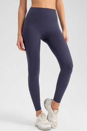 Indigo high-waist performance leggings with sculpting seams.
