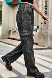Cargo denim relaxed fit trousers in dark wash with multiple pockets and elastic waistband.