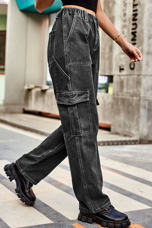 Cargo denim relaxed fit trousers in dark wash with multiple pockets and elastic waistband.