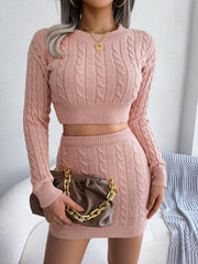 Dusty pink cable knit crop co-ord set with crew neck sweater and mini skirt.