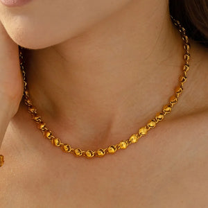 Gold orb chain necklace with 18K gold plating.