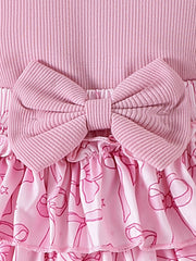 Pink ribbed cotton baby bodysuit with bowknot detail and ruffled skort with bow print