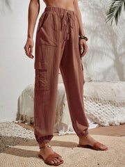 Textured cargo lounge trousers in brown with drawstring waist and cuffed ankles.