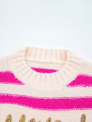Cream acrylic knit sweater with pink stripes and gold sequin graphic, crew neck.