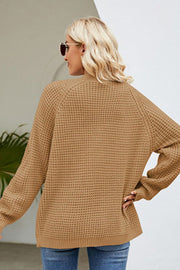 Khaki waffle knit cardigan with long sleeves and a relaxed fit.