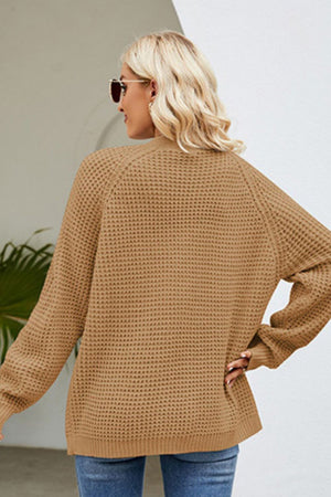 Khaki waffle knit cardigan with long sleeves and a relaxed fit.