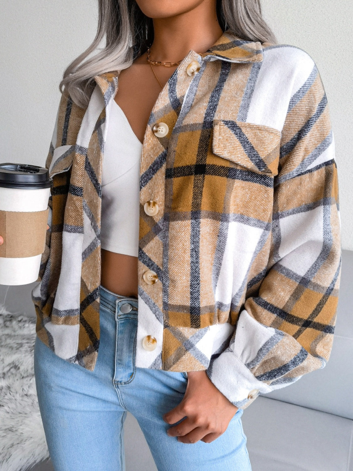 Oversized tartan shacket in camel with patch pockets and button front.