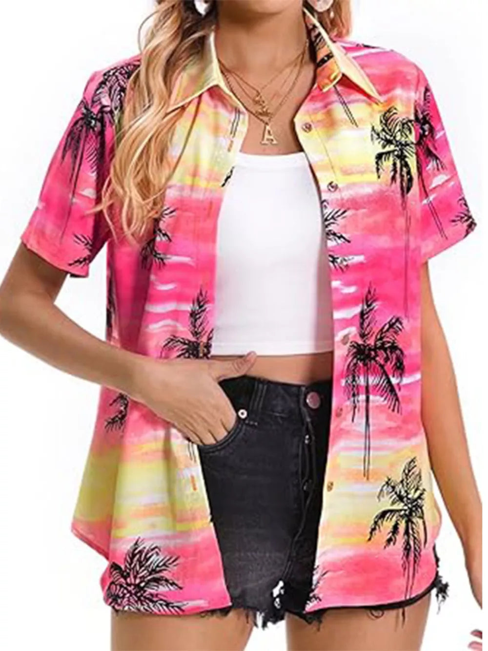 Tropical hibiscus print button-up shirt in pink, yellow, and white with palm trees.