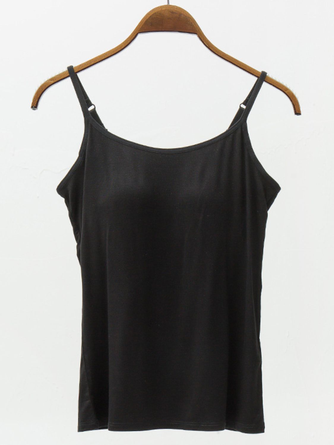 Black cami with adjustable spaghetti straps and a scoop neckline.