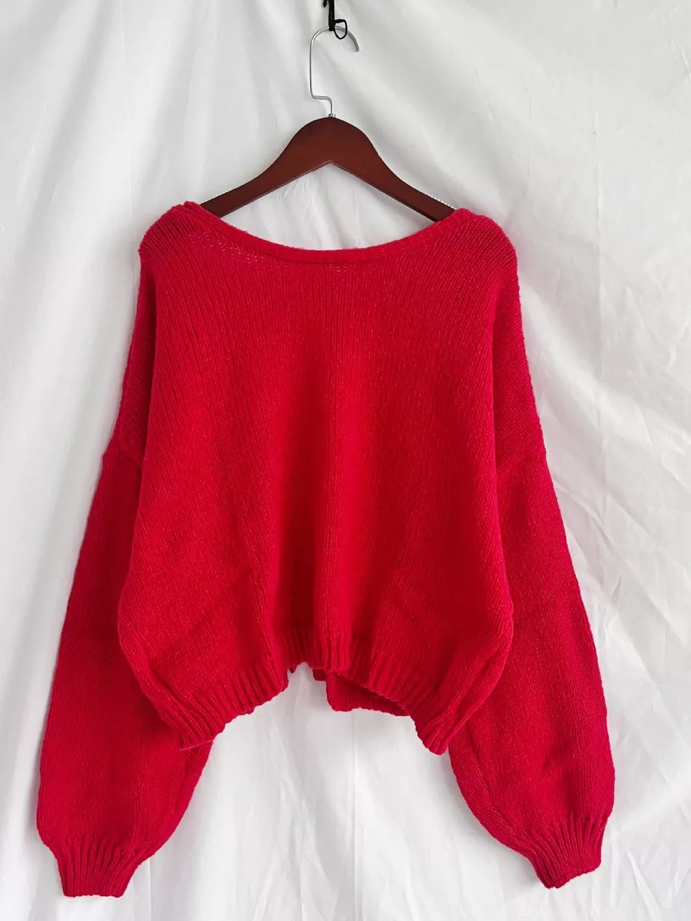 Scarlet tie-front knit cardigan with textured detail and balloon sleeves.