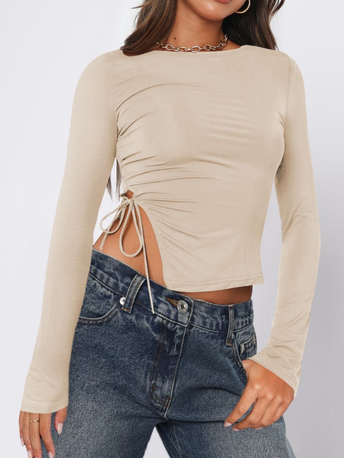 Long sleeve ruched top in beige with adjustable side tie detail