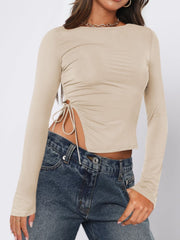 Long sleeve ruched top in beige with adjustable side tie detail
