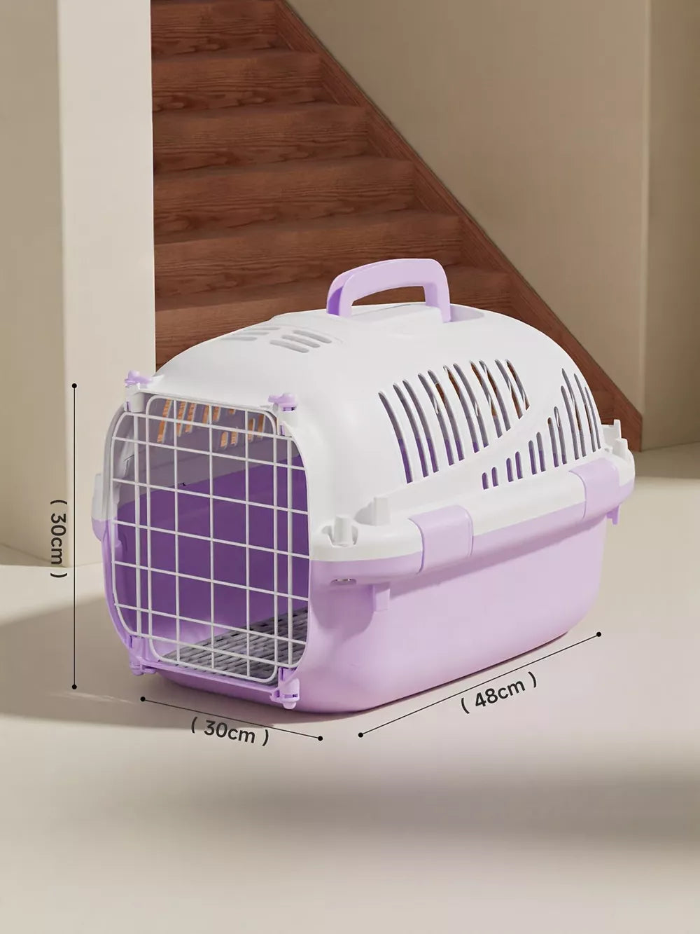 Cheerful ventilated pet carrier bag in pink purple with secure wire door and comfortable handle.