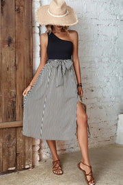 Black asymmetric stripe midi skirt with bow detail and thigh-high slit