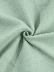 Sage cotton joggers with a soft, textured finish.