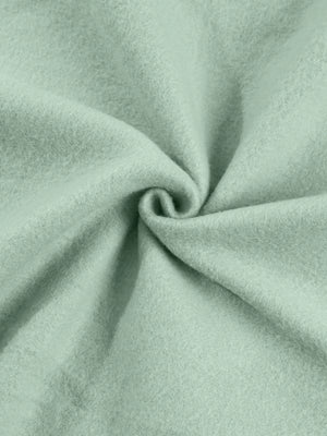 Sage cotton joggers with a soft, textured finish.