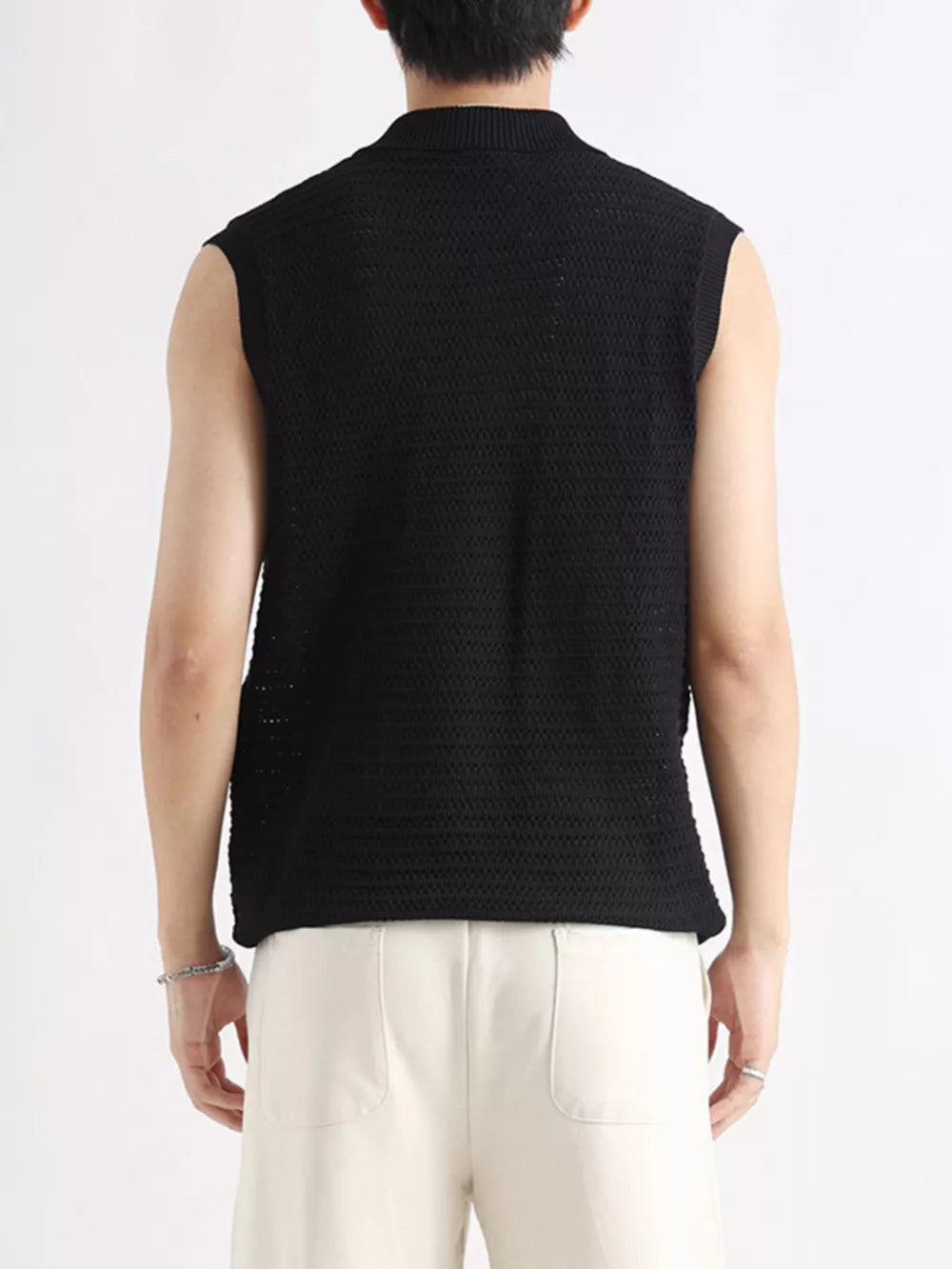 Black knit polo collar tank top with a textured pattern.
