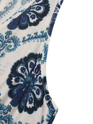 Maxi dress with blue paisley print, V-neck, and sleeveless cut.