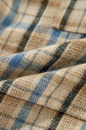 Textured plaid hooded overshirt in tan with blue and black accents, featuring a raw hem detail.