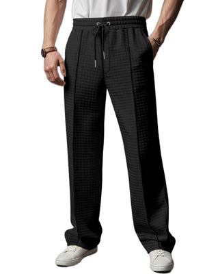 Black textured drawstring sweatpants for men with a casual fit.