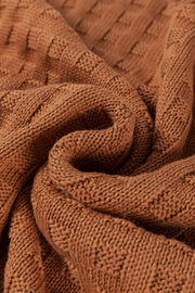 Textured knit boxy top in camel acrylic with a diamond pattern.