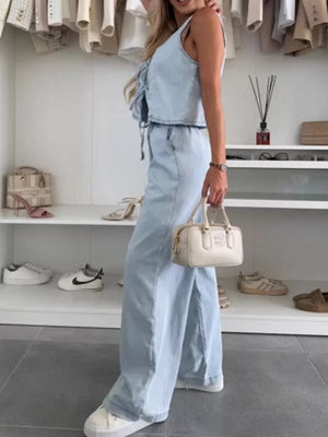 Light blue denim tied vest and relaxed wide-leg pants set with lace-up detail.