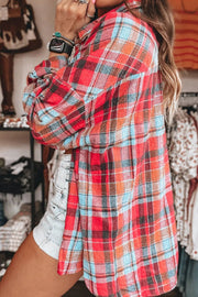 Oversized plaid shacket in orange and deep red with button-down collar.