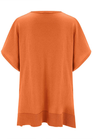 Relaxed V-neck knit poncho top in pumpkin with short sleeves and ribbed hem.
