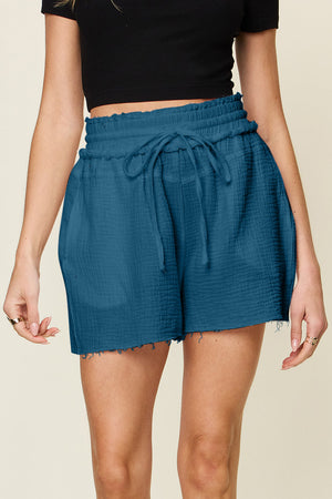 Dark blue textured gauze drawstring waist shorts with frayed hem