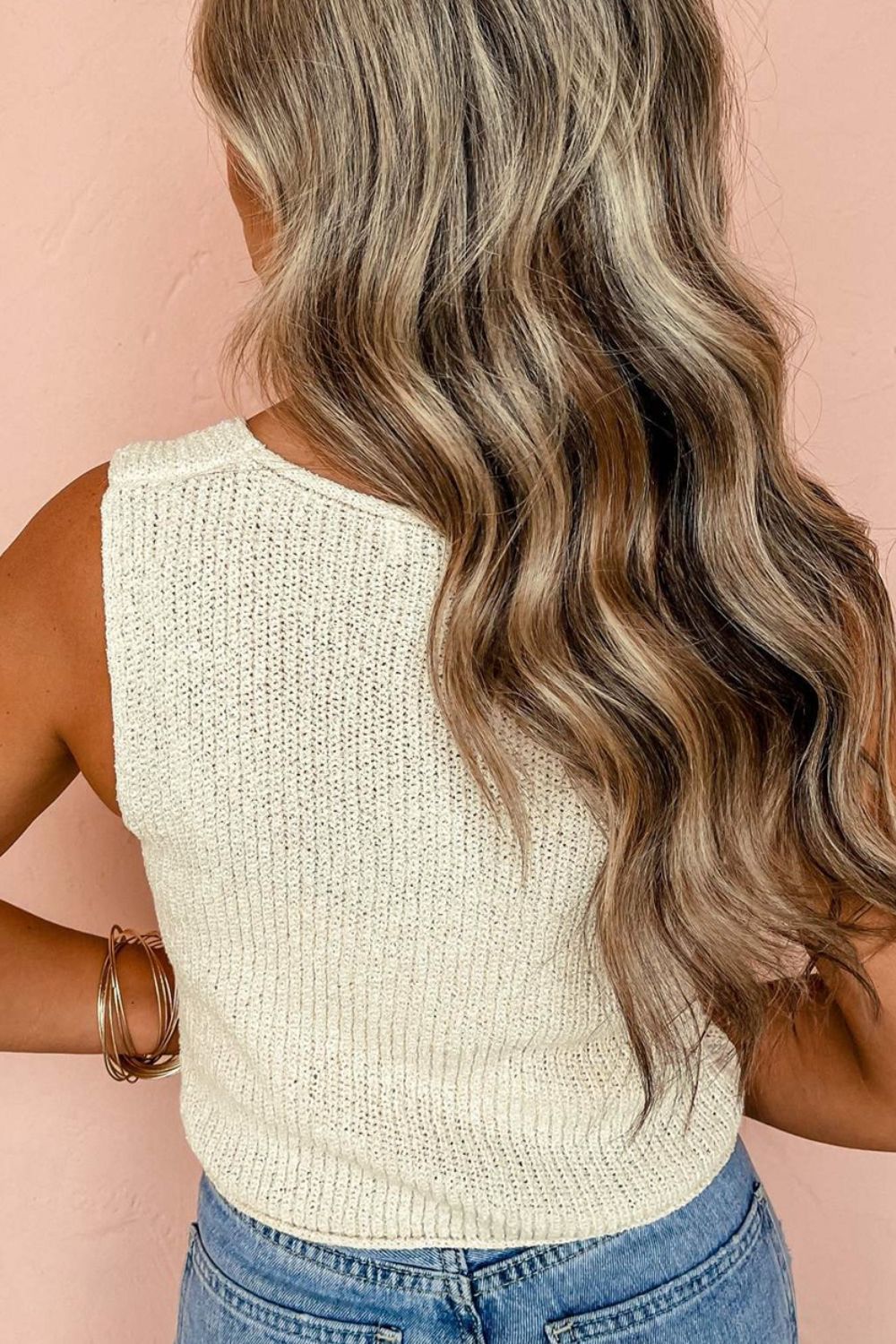 Beige textured knit tank top with a ribbed knit pattern and a tie-front detail.