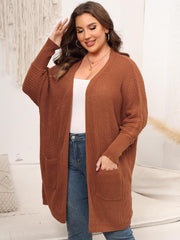 Oversized ribbed knit duster cardigan in ochre with pockets and dolman sleeves.