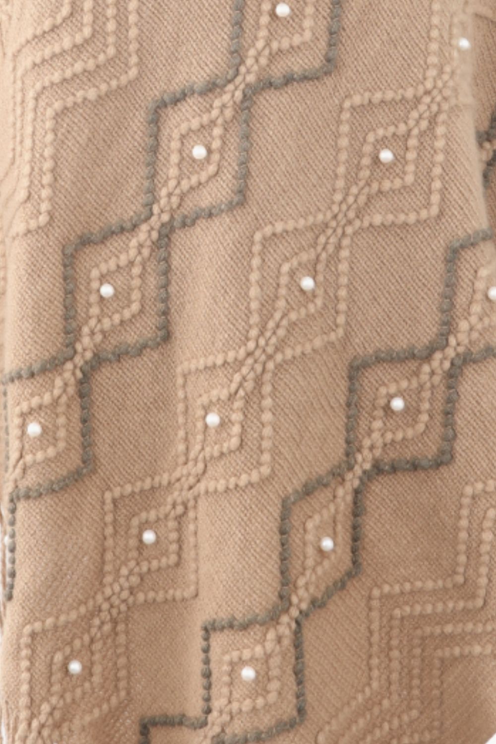 Khaki knit poncho with geometric pattern and pearl embellishments