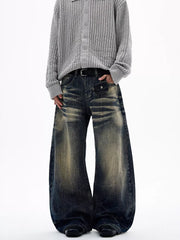 Men's vintage wash wide leg jeans with distressed detailing and a relaxed fit.