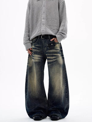 Men's vintage wash wide leg jeans with distressed detailing and a relaxed fit.