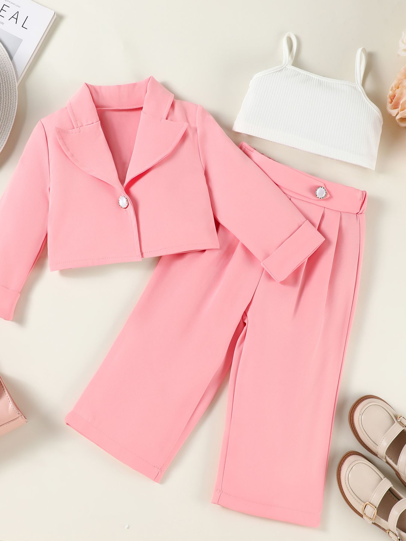 Pink toddler cropped blazer and wide-leg pants set with white ribbed cami.