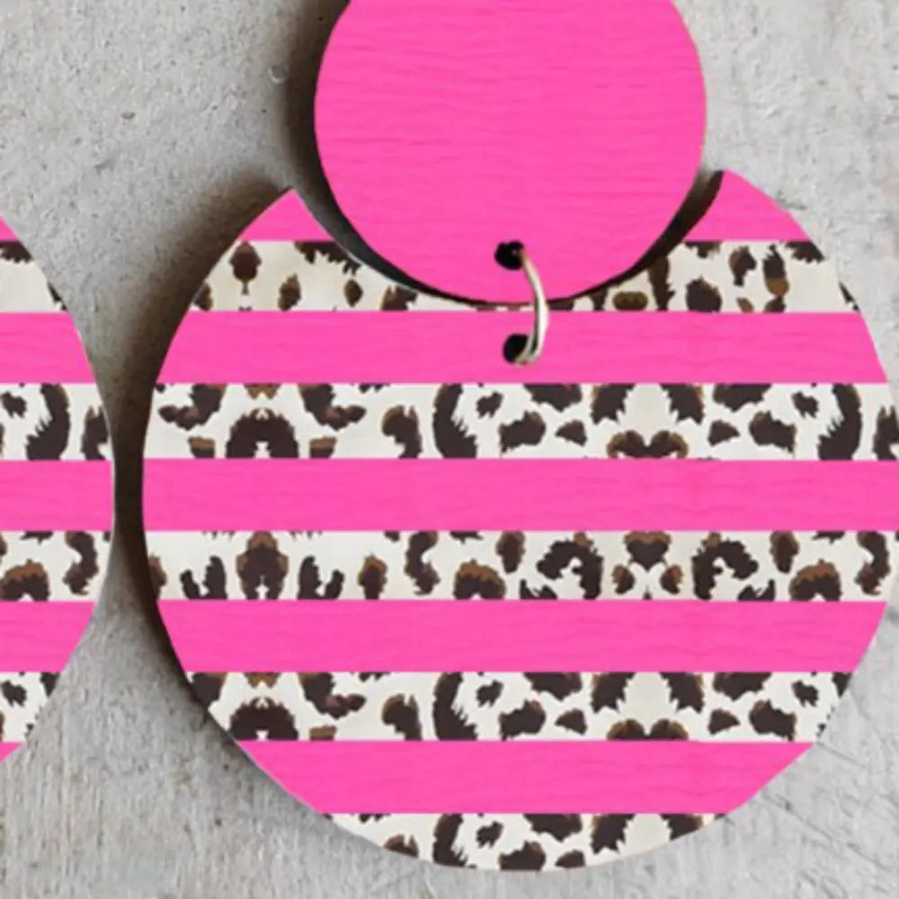 Hot pink stripe leopard print statement earrings with a circular design.