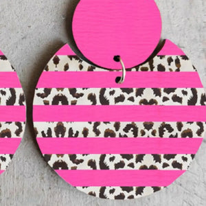 Hot pink stripe leopard print statement earrings with a circular design.