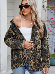 Leopard print utility denim jacket with chest pockets and button front.