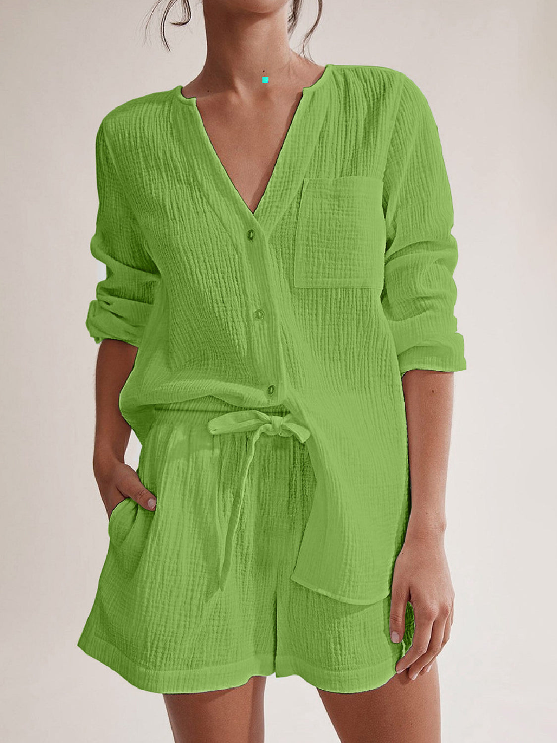 Lime green textured cotton pajama set with drawstring shorts and button-up top.